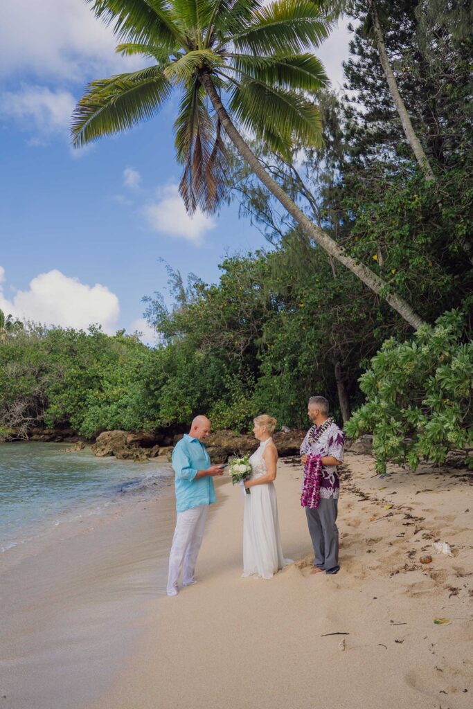 A couple renewing their vows at Kawela Bay, Oahu
