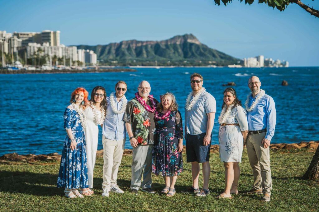 Family photo after a vow renewal at Magic Island, Oahu.